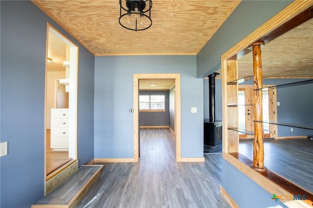 corridor with dark hardwood / wood-style flooring