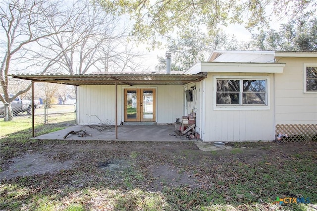 rear view of property with a patio and french doors