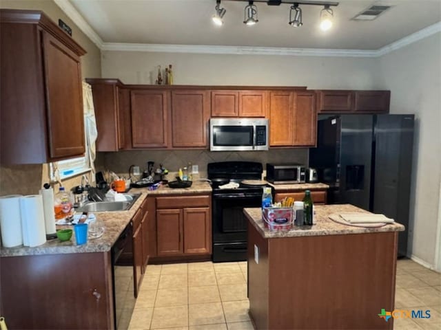 kitchen with black appliances, tasteful backsplash, ornamental molding, a kitchen island, and sink