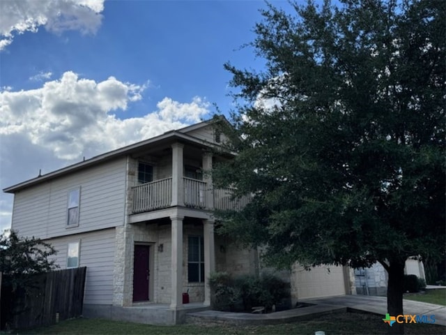 view of front of property with a balcony