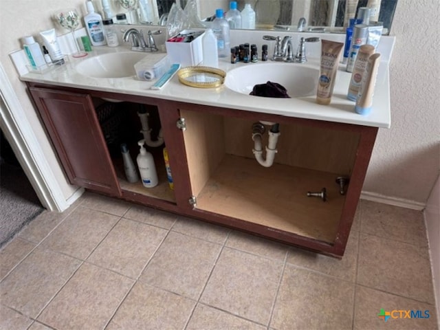 bathroom with tile patterned floors and sink