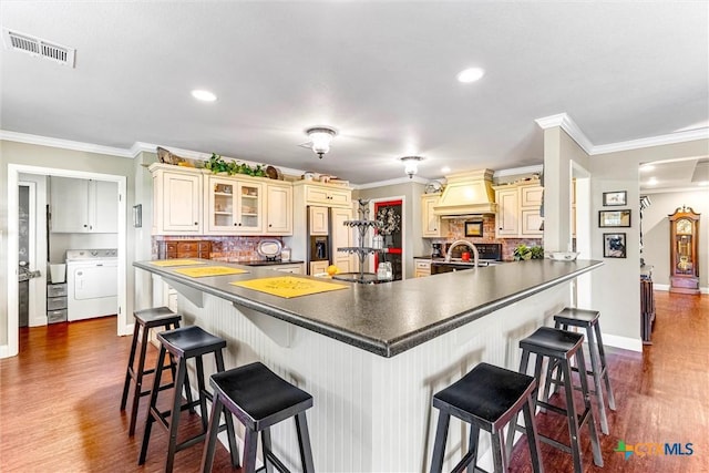 13755 N Lone Star Pkwy, Valley Mills, TX 76689 - kitchen with custom range hood, visible vents, cream cabinets, and washer / clothes dryer