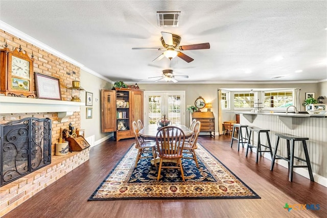 13755 N Lone Star Pkwy, Valley Mills, TX 76689 - dining room featuring a wealth of natural light, crown molding, a fireplace, and visible vents