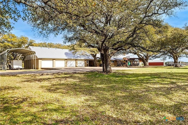 13755 N Lone Star Pkwy, Valley Mills, TX 76689 - view of front facade with metal roof, a front lawn, driveway, and a carport