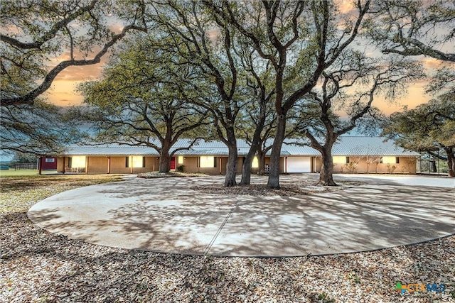 13755 N Lone Star Pkwy, Valley Mills, TX 76689 - single story home featuring metal roof, curved driveway, and a garage