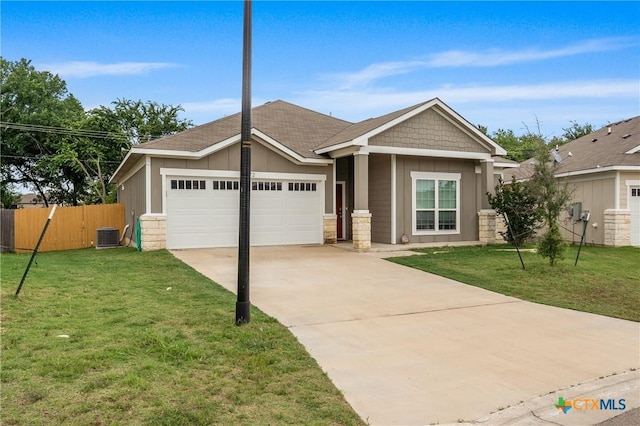 372 Poplin Ln, Troy, TX 76579 - view of front facade with a garage, driveway, board and batten siding, central air condition unit, and stone siding