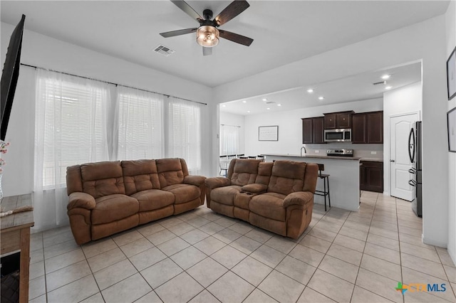 372 Poplin Ln, Troy, TX 76579 - living area featuring light tile patterned floors, ceiling fan, and recessed lighting