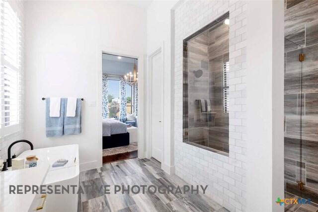 435 Nash Way, New Braunfels, TX 78130 - bathroom with a shower with door and a chandelier