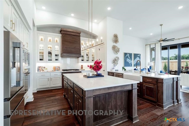 435 Nash Way, New Braunfels, TX 78130 - kitchen featuring a kitchen island, pendant lighting, stainless steel appliances, and dark brown cabinetry