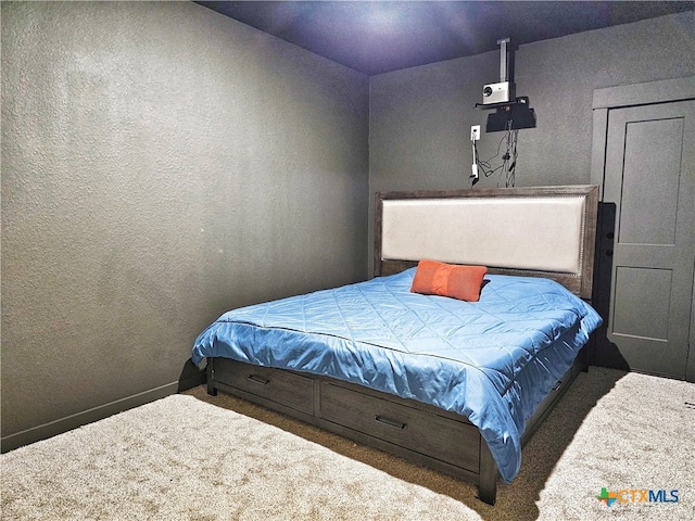 bedroom featuring dark carpet