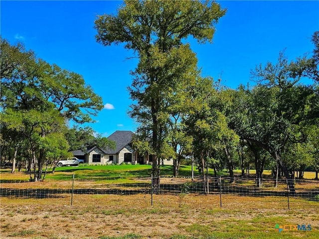 view of home's community featuring a rural view