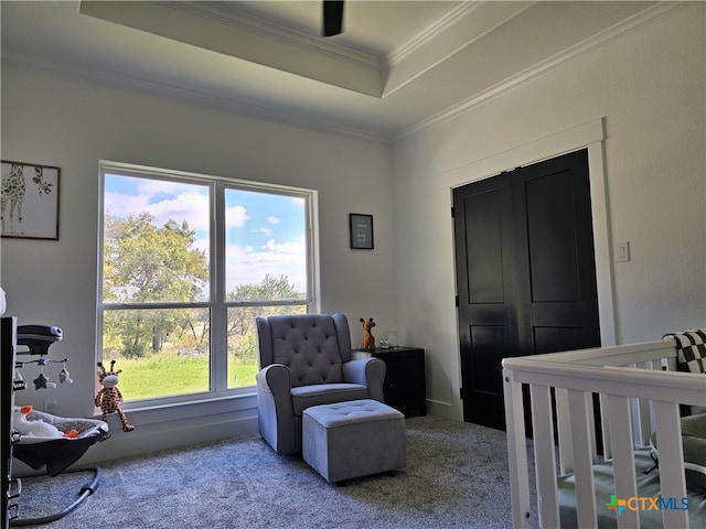 bedroom with carpet, multiple windows, a nursery area, and crown molding