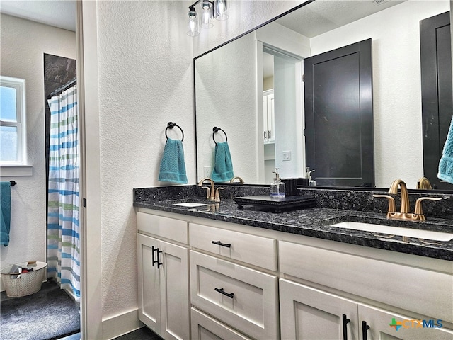 bathroom featuring vanity and walk in shower