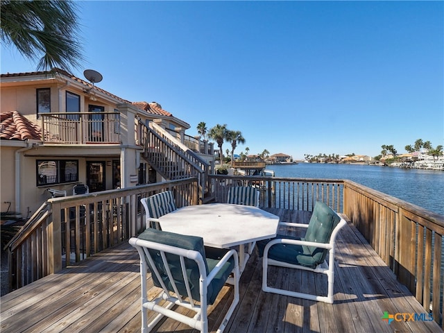 deck featuring a water view