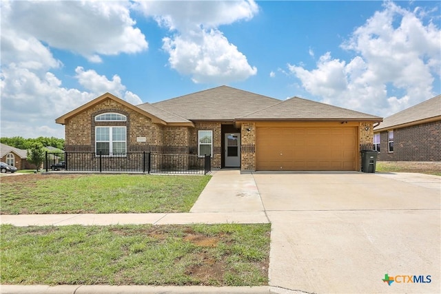 ranch-style home with a fenced front yard, driveway, brick siding, and an attached garage