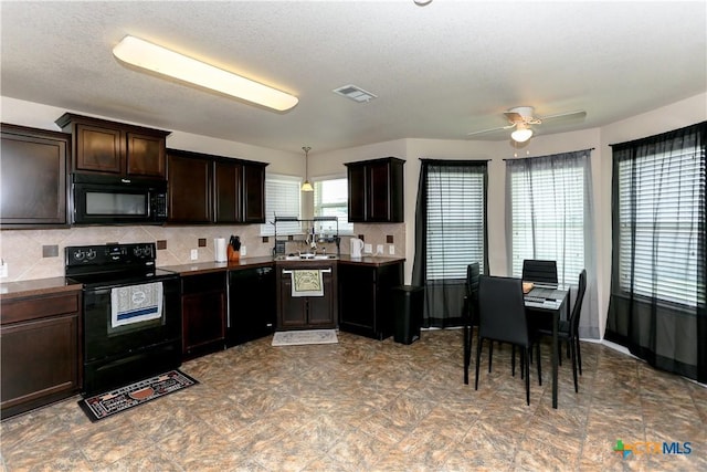 2100 Golden Eagle Dr, Killeen, TX 76549 - kitchen featuring black appliances, dark brown cabinetry, dark countertops, and backsplash
