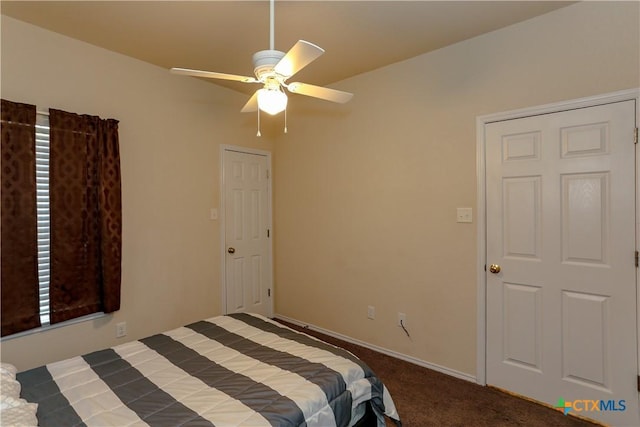 carpeted bedroom featuring baseboards and ceiling fan
