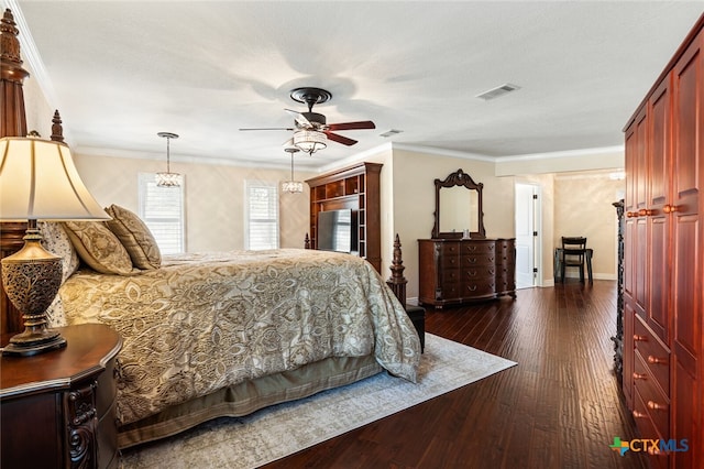 bedroom with ceiling fan, dark hardwood / wood-style floors, and crown molding