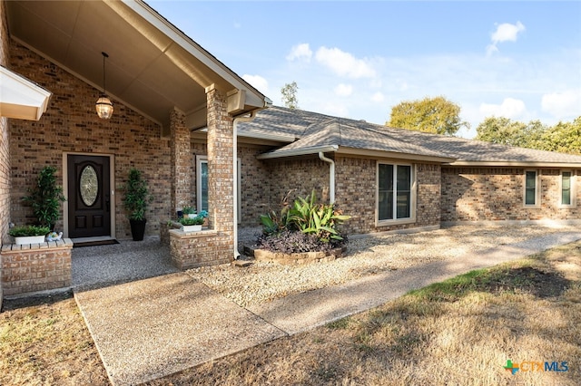 doorway to property featuring a patio