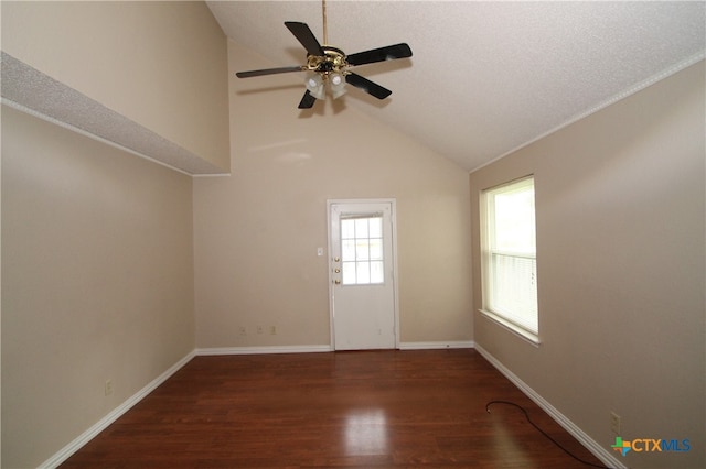 unfurnished room featuring a textured ceiling, ceiling fan, dark hardwood / wood-style flooring, and lofted ceiling