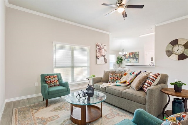 living room featuring crown molding, plenty of natural light, and hardwood / wood-style flooring