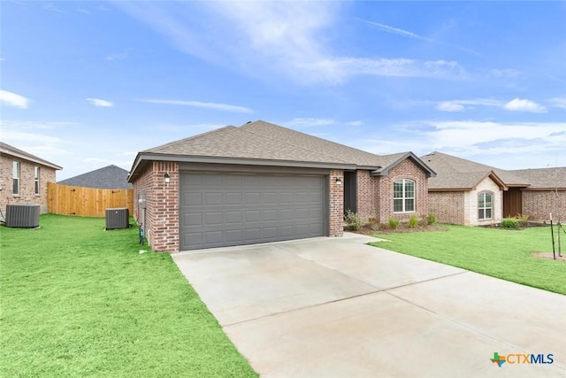 ranch-style house with a front lawn, a garage, and central AC