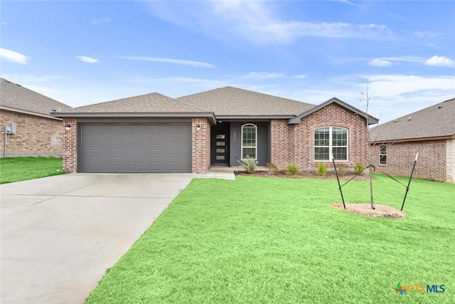 single story home featuring a garage and a front yard