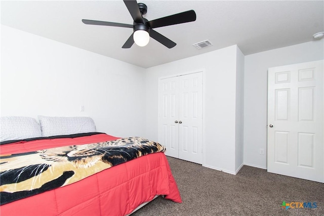 carpeted bedroom featuring a closet and ceiling fan