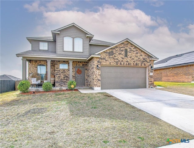 front of property with a garage, a porch, and a front lawn