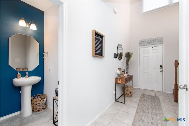 tiled entrance foyer featuring sink