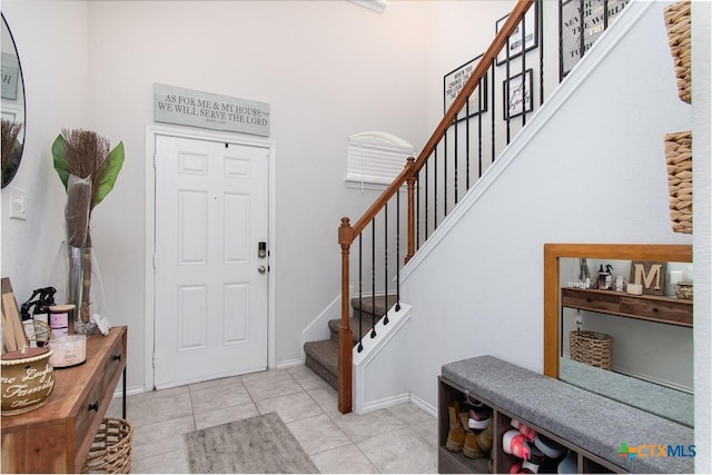 entryway with light tile patterned floors