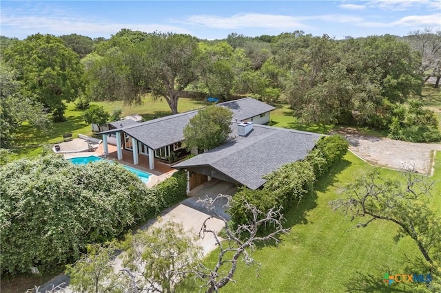 1223 N Sarah Dewitt Dr, Gonzales, TX 78629 - view of subject property with a pool and a forest