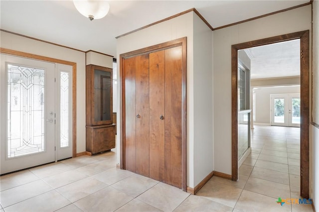 1223 N Sarah Dewitt Dr, Gonzales, TX 78629 - foyer entrance with ornamental molding, light tile patterned floors, and baseboards