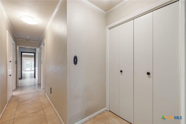 1223 N Sarah Dewitt Dr, Gonzales, TX 78629 - hall featuring crown molding, light tile patterned floors, and baseboards