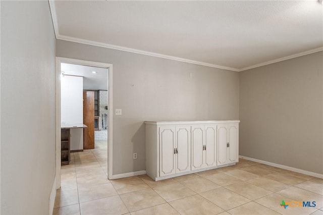 1223 N Sarah Dewitt Dr, Gonzales, TX 78629 - empty room with light tile patterned flooring, ornamental molding, and baseboards