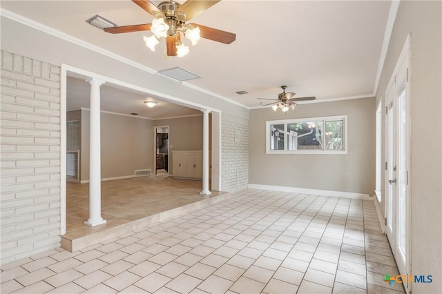 1223 N Sarah Dewitt Dr, Gonzales, TX 78629 - unfurnished living room with decorative columns, a ceiling fan, light tile patterned floors, ornamental molding, and baseboards