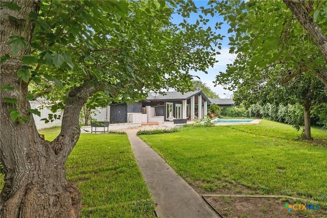 1223 N Sarah Dewitt Dr, Gonzales, TX 78629 - view of green lawn with an outdoor pool