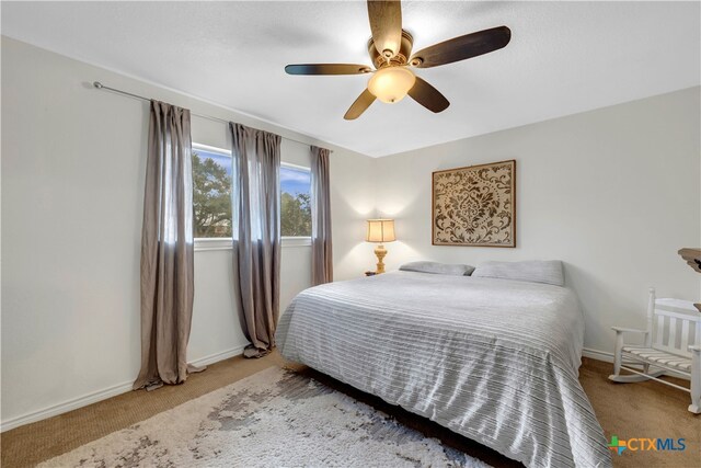 bedroom featuring ceiling fan and carpet floors