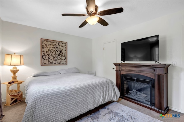 bedroom with ceiling fan and carpet