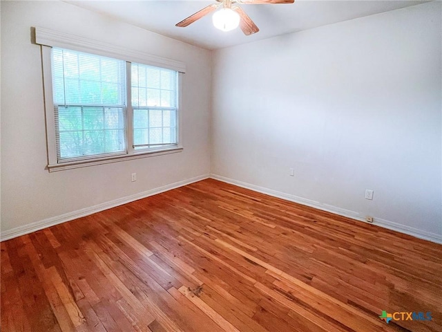 1412 N Beal St, Belton, TX 76513 - unfurnished room with wood finished floors, a ceiling fan, and baseboards