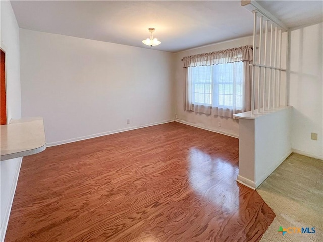1412 N Beal St, Belton, TX 76513 - spare room with wood finished floors and baseboards