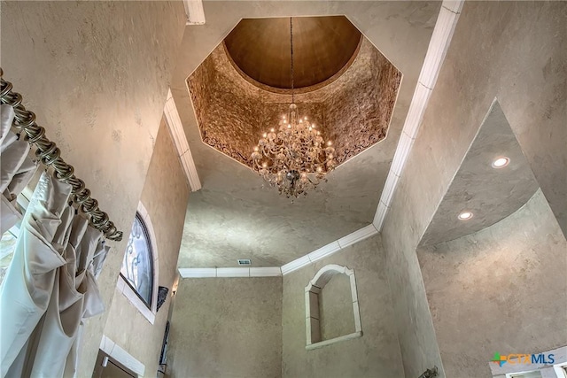 room details featuring a chandelier and crown molding