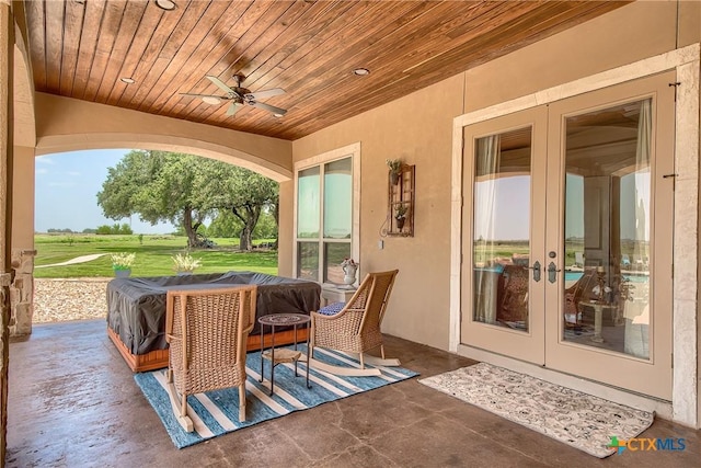 view of patio with a ceiling fan and french doors