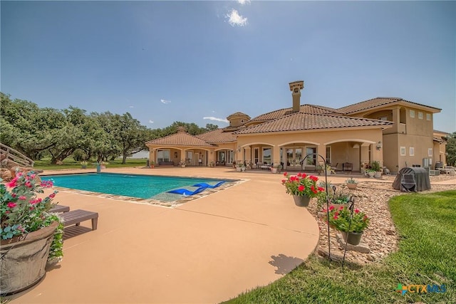 outdoor pool with a patio