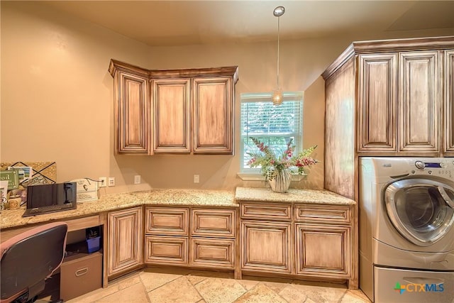 laundry area featuring washer / clothes dryer and cabinet space