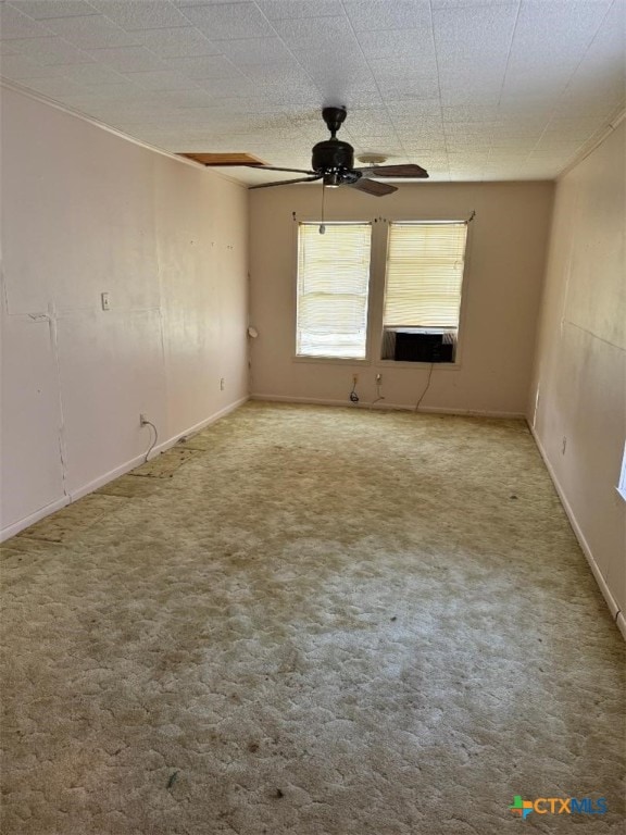 carpeted empty room with cooling unit and ceiling fan