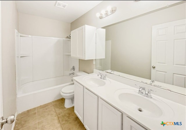 full bathroom with toilet, vanity, tile patterned floors, and shower / bathtub combination