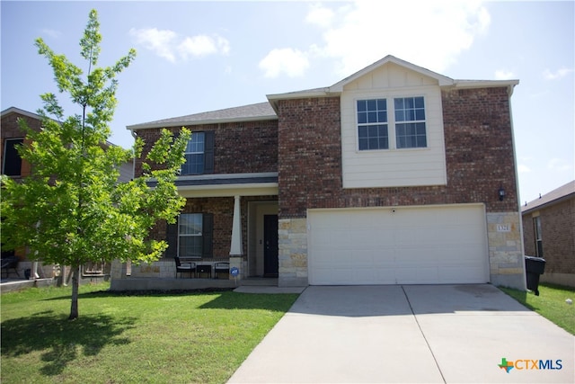 view of front facade featuring a garage and a front lawn