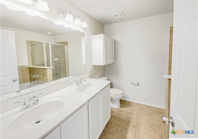 full bathroom featuring toilet, vanity, tile patterned floors, and independent shower and bath