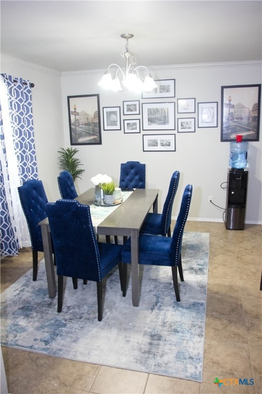 dining room with a notable chandelier, tile patterned floors, and crown molding